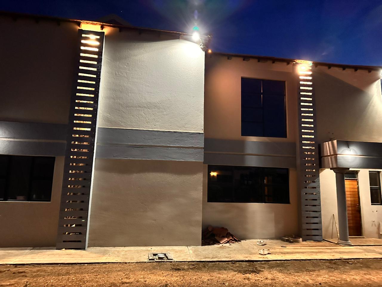 Building with professional lighting installation by Khesekho Electrical